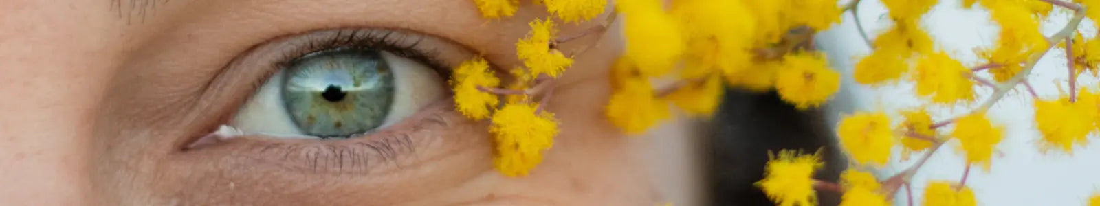 female eye with flower